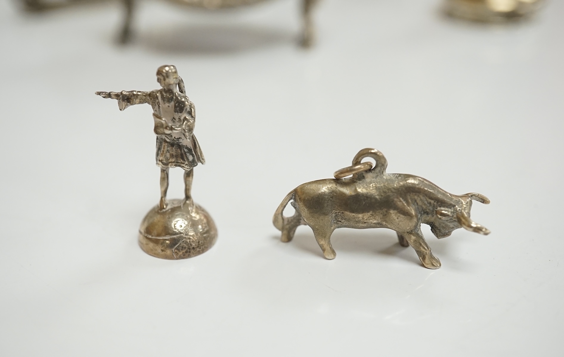 A collection of miniature silver and white metal figures and groups etc. including a swan sleigh, import marks for Chester, 1900, 41mm. Condition - poor to fair